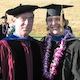 a recent graduate poses with a professor after commencement